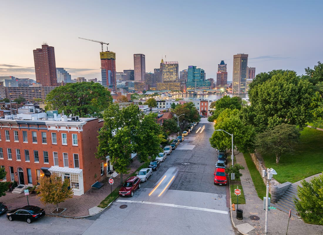 Columbia, MD - View of Federal Hill Row Houses and the Inner Harbor at Night in Baltimore, Maryland